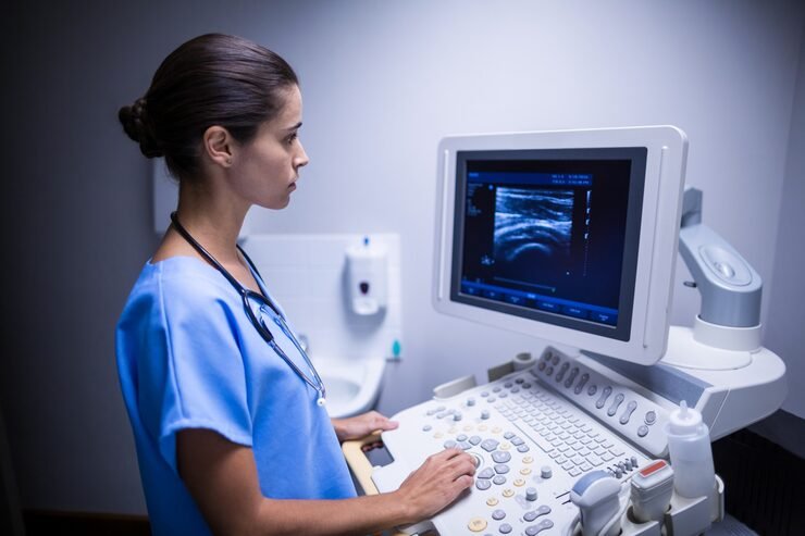 nurse examining ultrasonic monitor 107420 69462